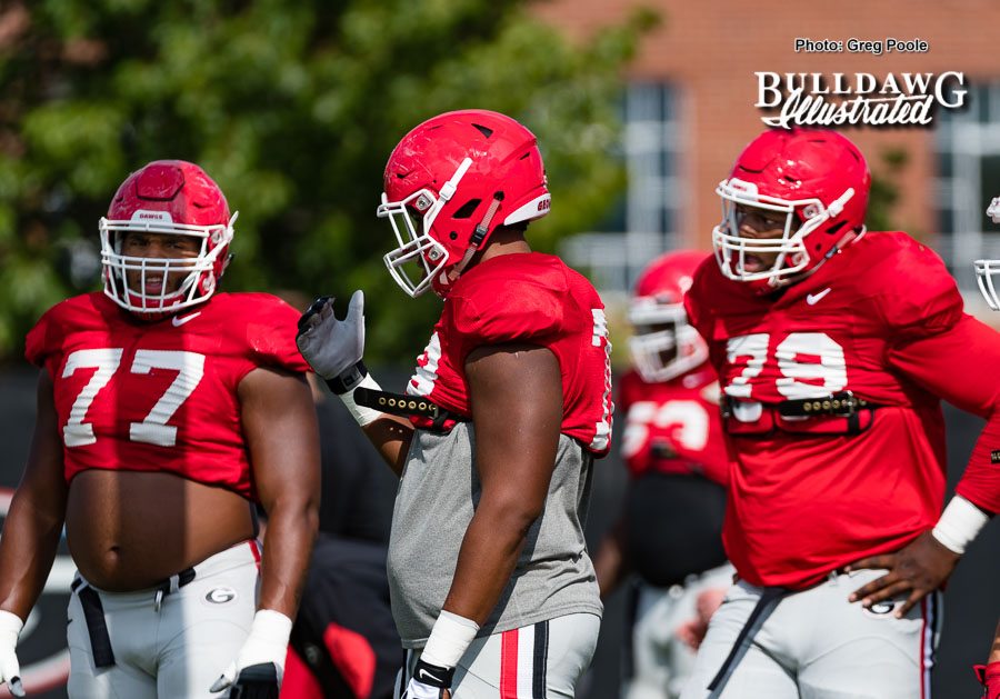 Isaiah Wynn (77), D'Marcus Hayes (78), and Isaiah Wilson (79) participate in a drill during Wednesday Sept. 13 practice.