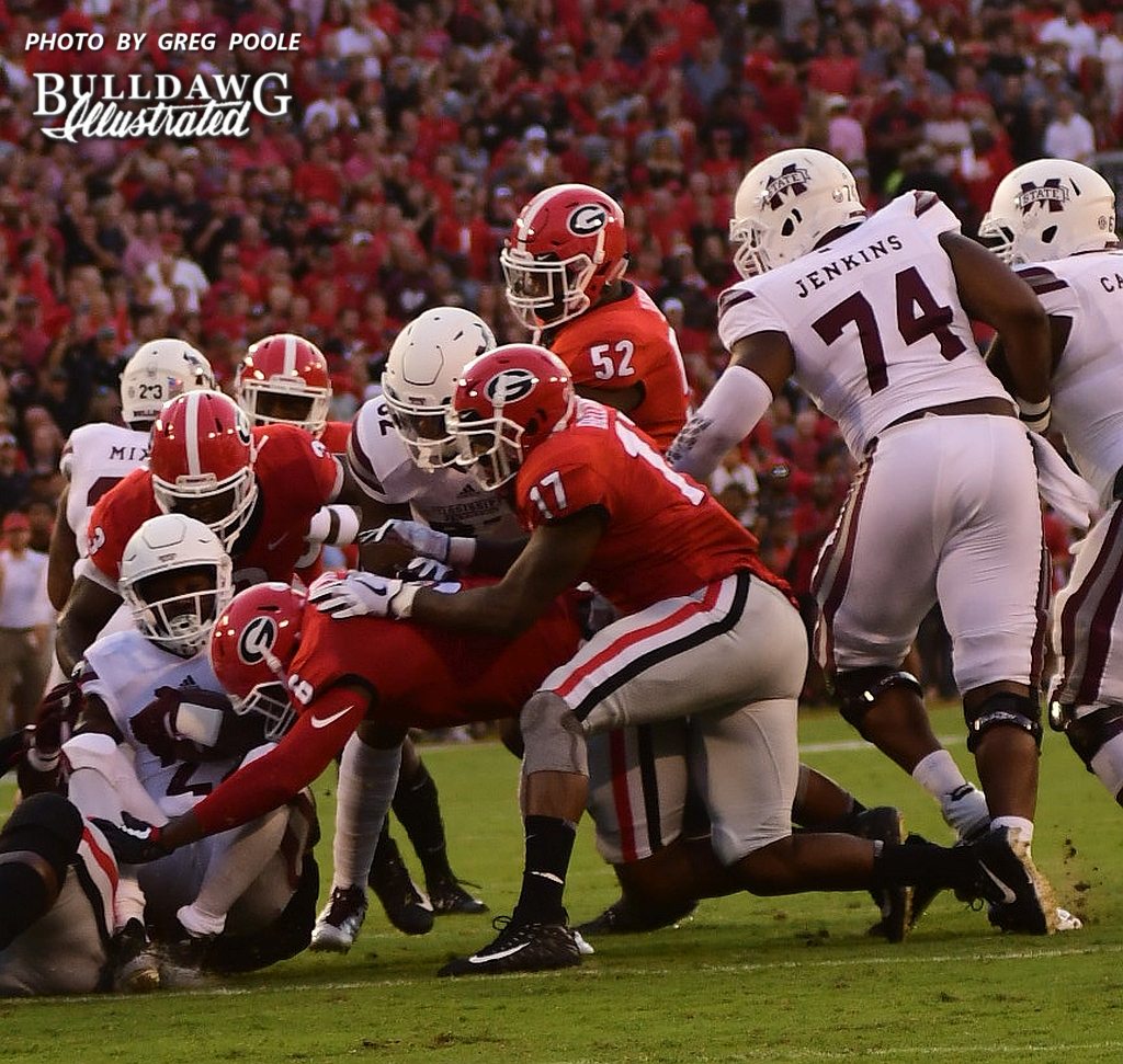 Linebackers Davin Bellamy (17), Natrez Patrick (6) and Roquan Smith (3) gang tackle Mississippi State RB Aeris Williams (22) - UGA vs. Mississippi State - Saturday, Sept. 23, 2017