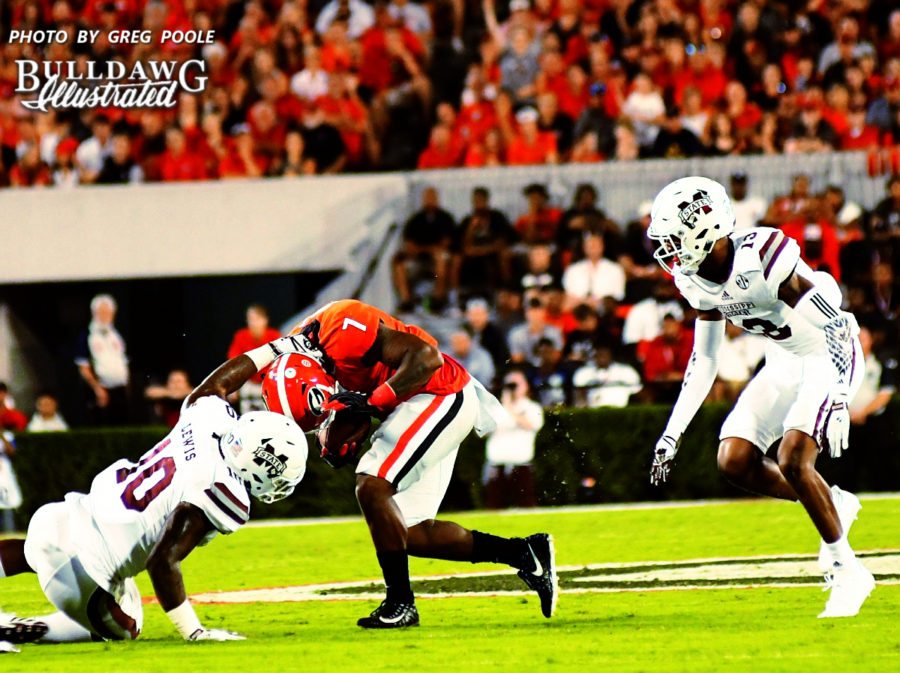 Georgia runningback D'Andre Swift (7) is "horse collared" by Mississippi State linebacker Leo Lewis (10) - UGA vs. Mississippi State - Saturday, Sept. 23, 2017