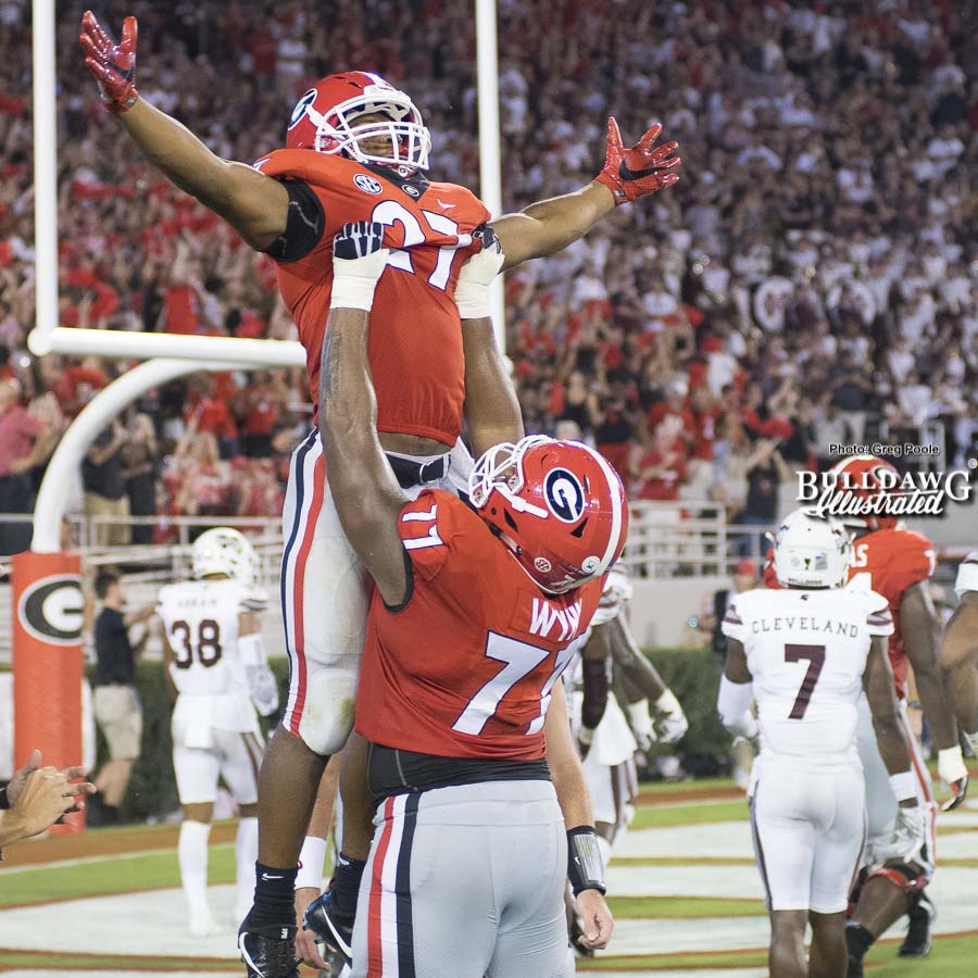 Isaiah Wynn (77) and Nick Chubb (27) celebrate the senior running back's 2nd touchdown on the night. - UGA vs. Mississippi State - Saturday, Sept. 23, 2017