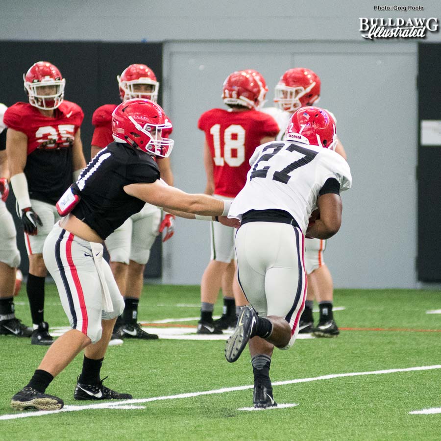 Jake Fromm 11 hands the ball off to Nick Chubb (27) during drill in Tuesdays practice