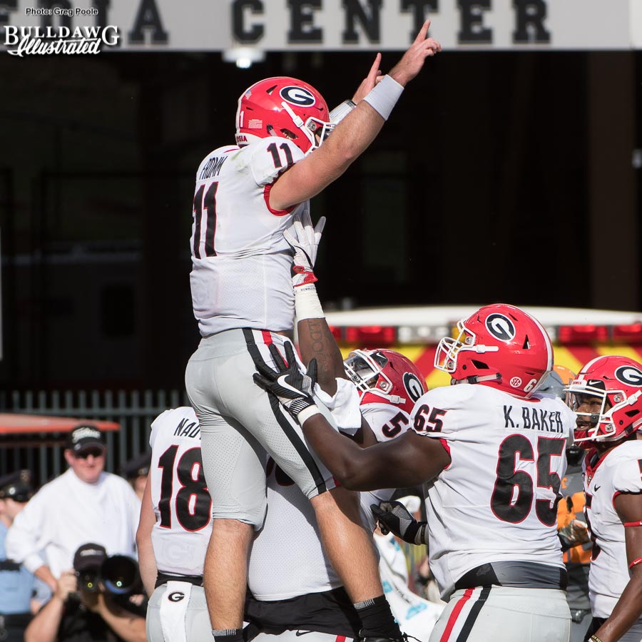 Georgia QB Jake Fromm (11) celebrates with Lamont Gaillard (53) and Kendall Baker (65) after he scores a 9-yard rushing TD - 2nd quarter, UGA vs. Tennessee - Saturday, Sept. 30, 2017