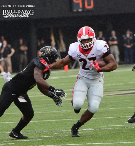 Nick Chubb (27) with a stiff arm on a Commodore - First half of the Georgia vs. Vanderbilt game - Saturday, October 7, 2017