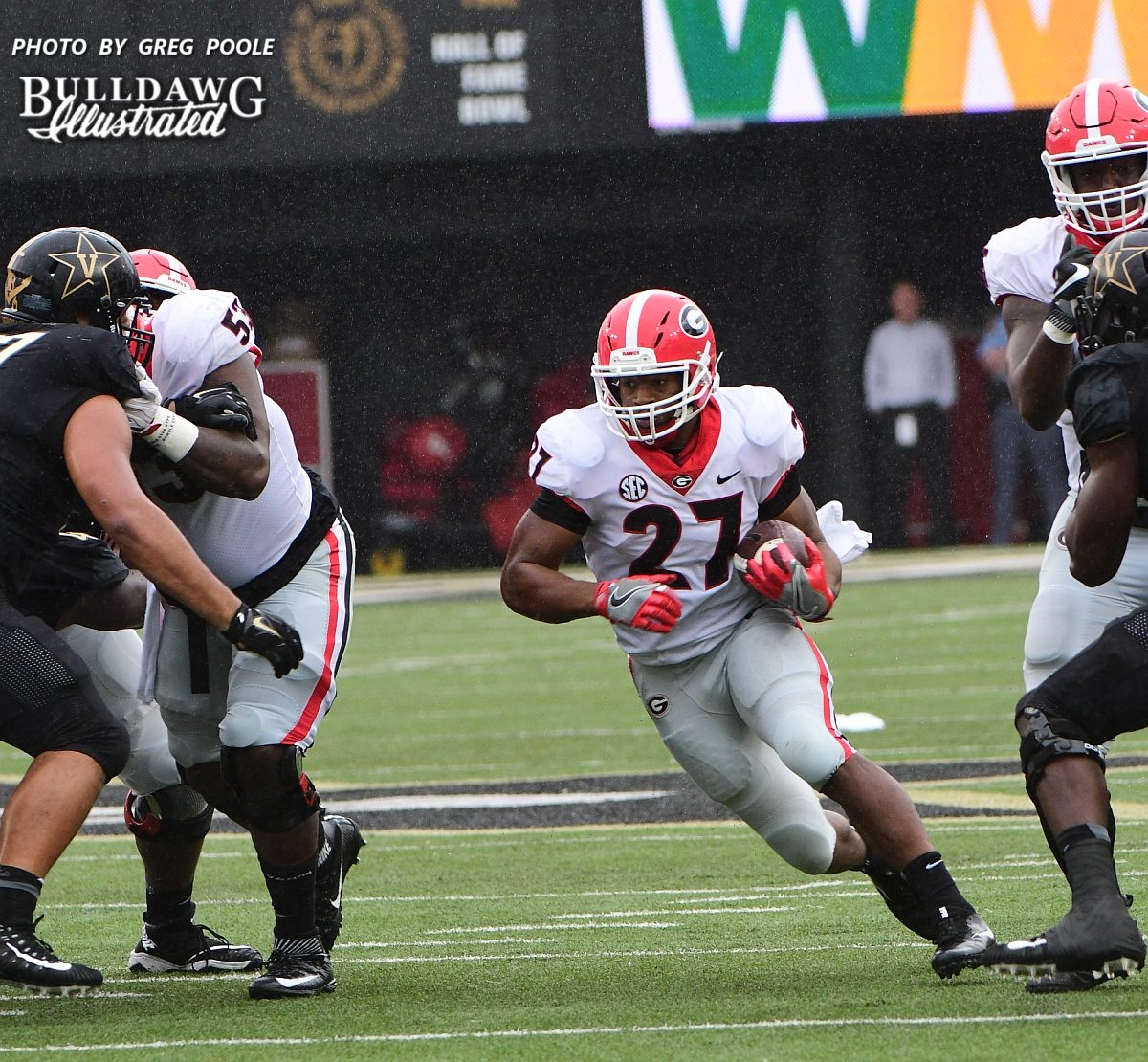 The Georgia O-line opens up a big hole for running back Nick Chubb (27)  -  First half of UGA vs. Vanderbilt -  Saturday, October 7, 2017
