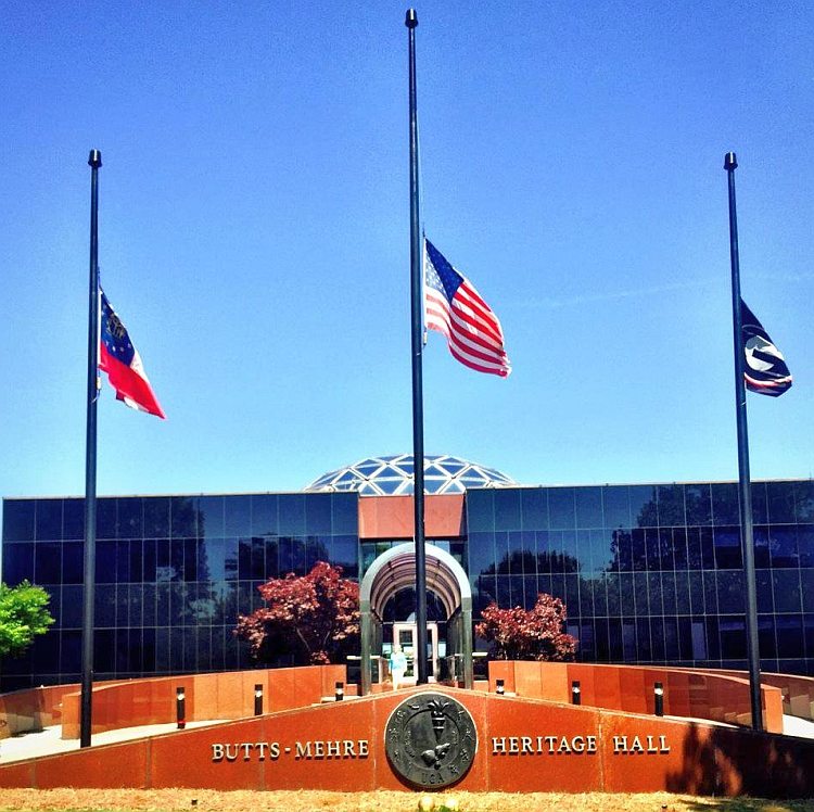 Flags at UGA's Butts-Mehre Heritage Hall fly at half-staff