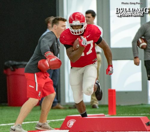 Nick Chubb running through ball security drills