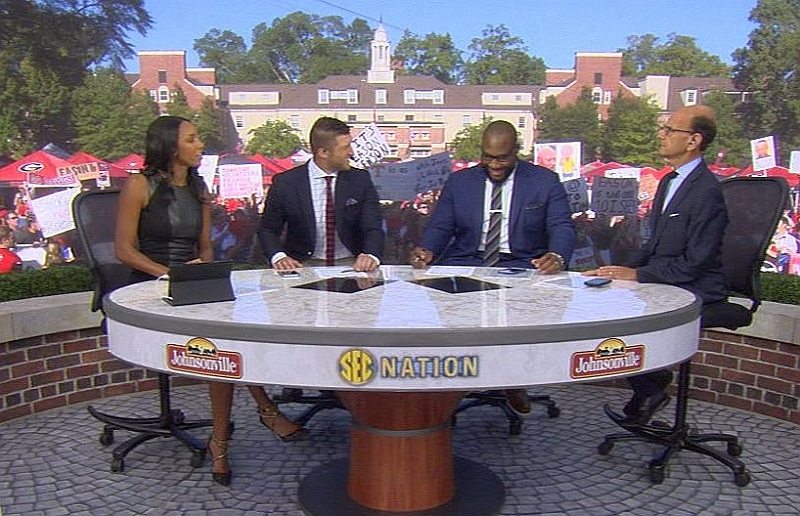 Tim Tebow, Marcus Spears and Paul Finebaum on the set of SEC Nation, Athens, GA (Photo is a screen capture of YouTube video)