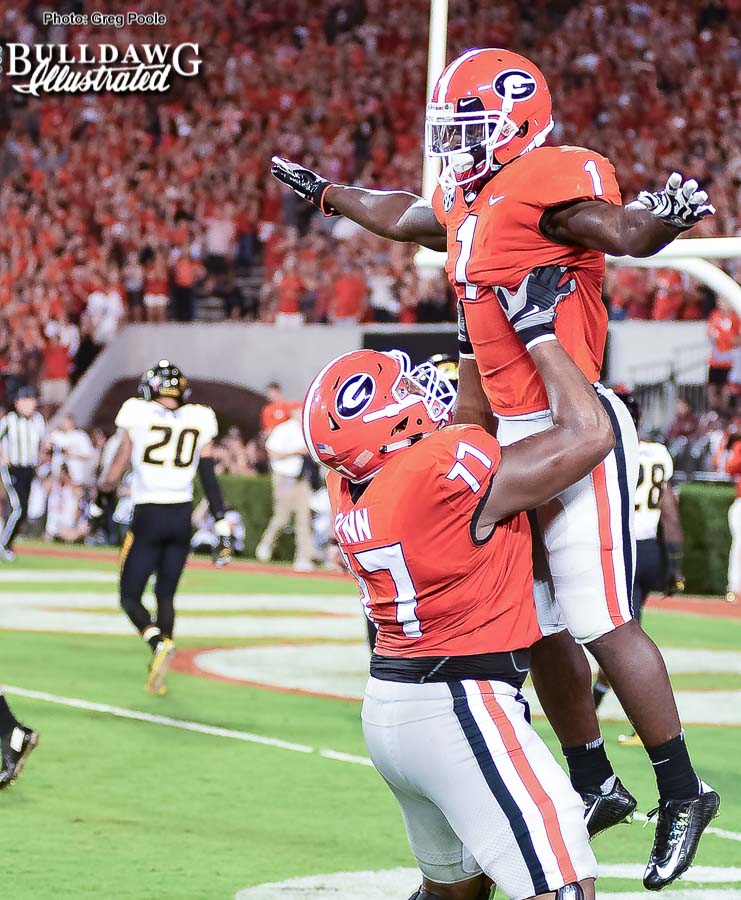 Isaiah Wynn (77) celebrated with Sony Michel (1) after the senior running back breaks off a 35-yard touchdown run in the second quarter to put the Bulldogs back on top 20-14. - UGA vs. Missouri - Saturday, Oct. 14, 2017