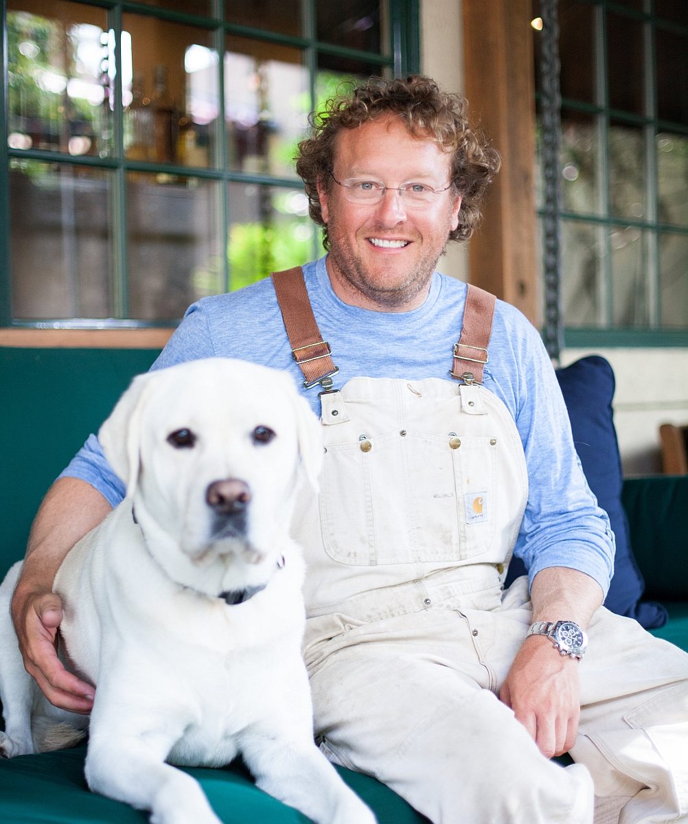 Chef Dave Snyder with his yellow lab Gustavo (Photo by Lilly Jo Photography)