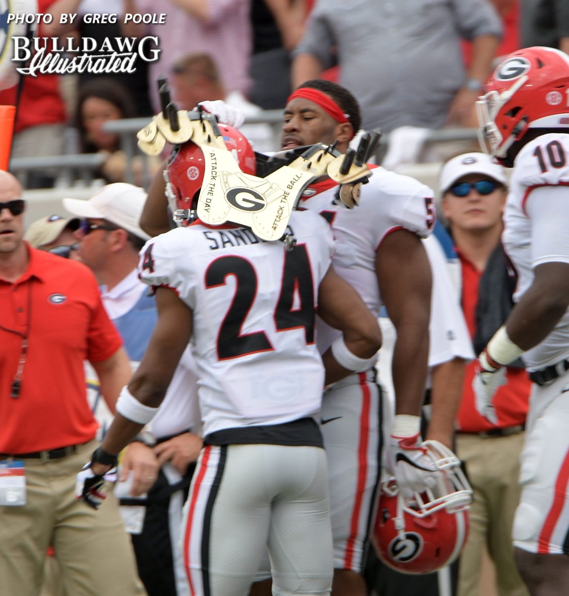 Dominick Sanders gets the 'golden spikes' after nabbing his 15th career interception during the Georgia-Florida game on Saturday, Oct. 28, 2017