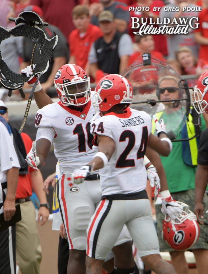 Malik Herring (10) congratulates Dominick Sanders (24) after the senior safety picks off his 15th career intecption. - Georgia-Florida, Saturday, Oct. 28, 2017 -