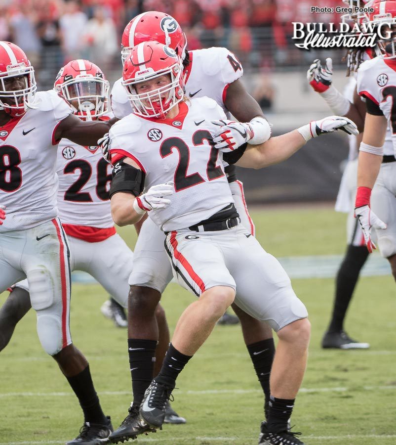 After Nate McBride (22) delivers a big hit on kickoff coverage in the second half of the Georgia-Florida game, the Bulldogs are fired up.