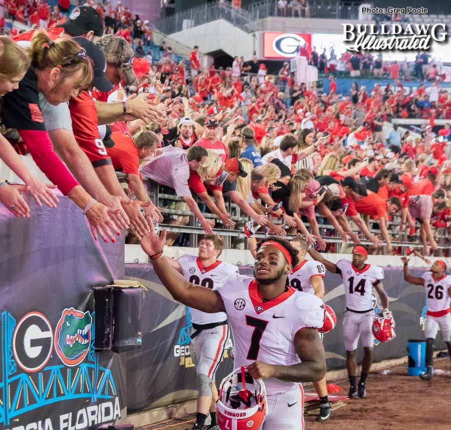 D'Andre Swift (7) and the Georgia football team celebrate a 42-7 win with Bulldog fans over bitter SEC East rival Florida on Saturday, Oct. 28, 2017 in Jacksonville.