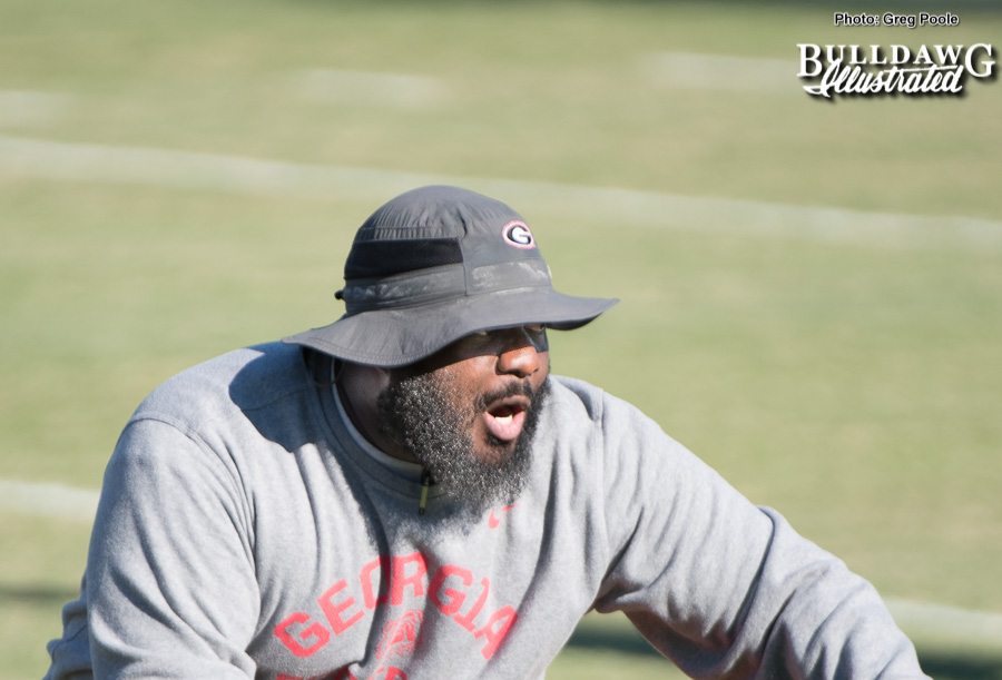 Defensive line coach Trey Scott motivates his players on Tuesday.
