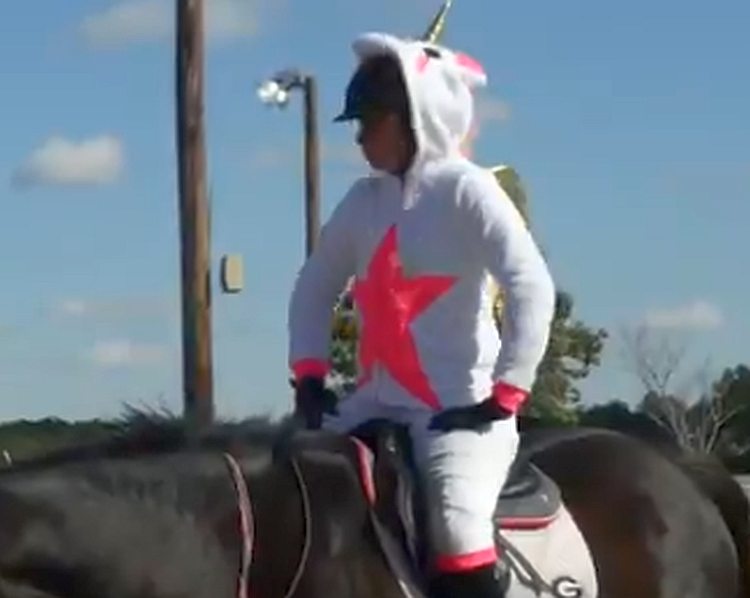 Georgia equestrian team member dresses up in a Halloween costume for practice
