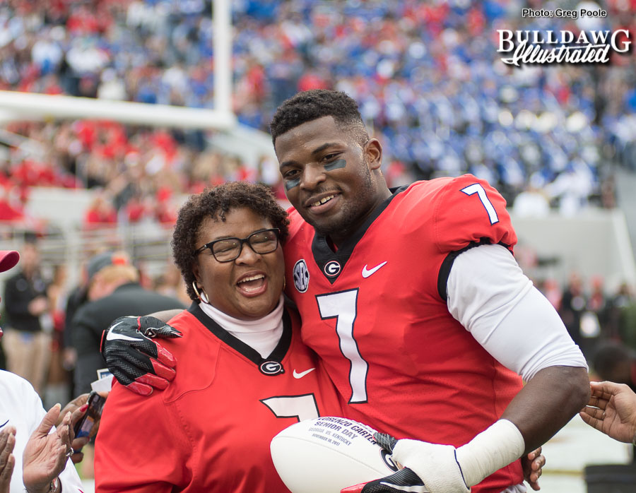 Linebacker Lorenzo Carter with his mom being honored on Senior Day at Georgia vs. Kentucky on Saturday, Nov. 18, 2017.