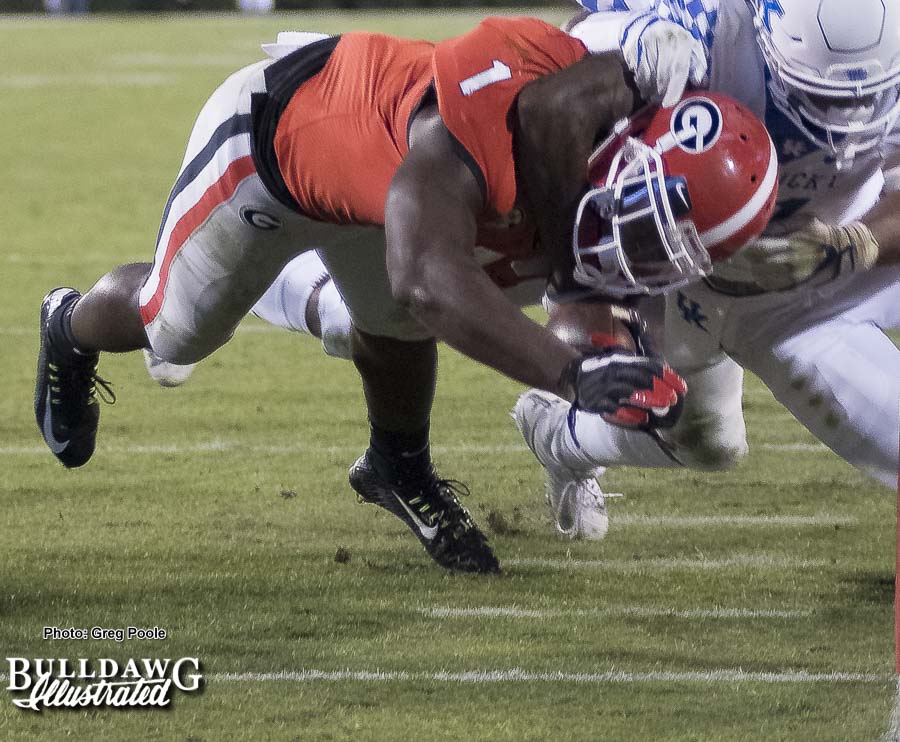 That's one way to bring Georgia's Sony Michel (1) down, but it was not successful. The senior running back made it to the pylon to score six for the Bulldogs. - Georgia vs. Kentucky - Saturday, Nov. 18, 2017
