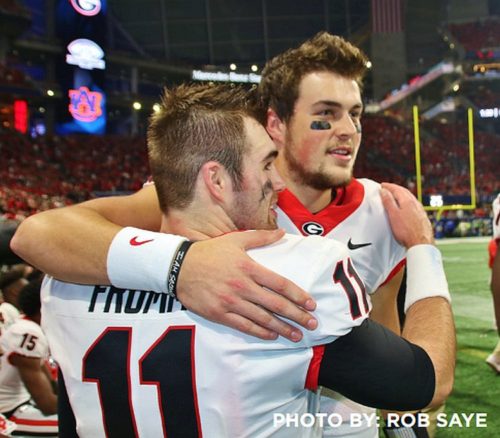 Bulldog quarterbacks Jake Fromm and Jacob Eason celebrate Georgia's 28-7 win over Auburn in the 2017 SEC Championship game. (Photo by Rob Saye)