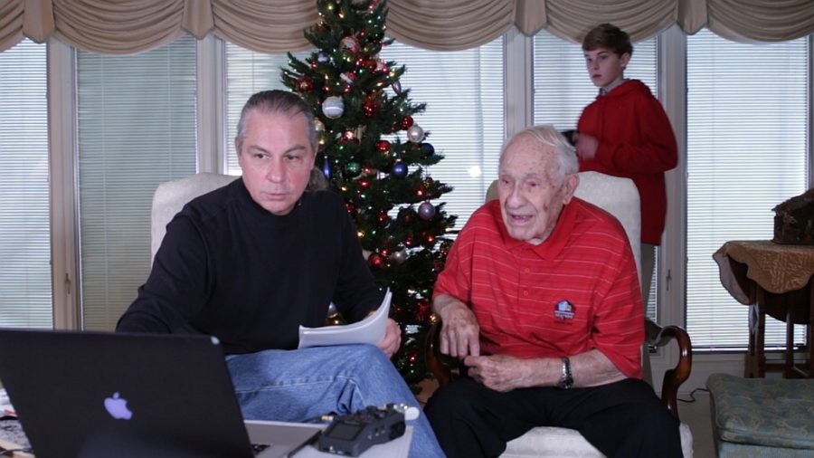 Mark Maxwell showing the 1943 Rose Bowl to UGA legend, Charley Trippi with Hamilton Culpepper taking in the memorable moment.