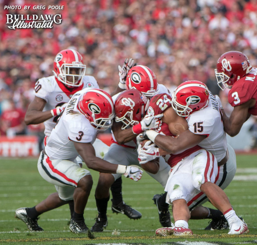 J.R. Reed (20), Roquan Smith (3), D'Andre Walker (15) and a fourth Bulldog all close in on Sooner ball carrier, Rodney Anderson (24) during the 2018 Rose Bowl game. (Photo: Greg Poole/Bulldawg Illustrated)