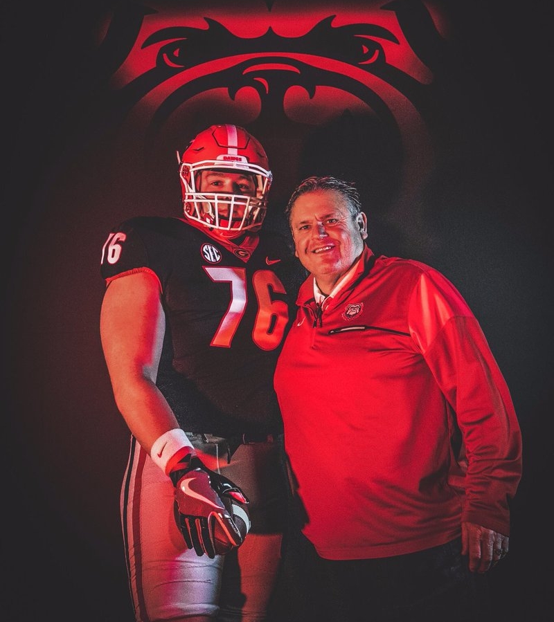 Harry Miller (left) with Georiga Offensive Line Coach Sam Pittman (right) on visit to UGA. (Photo from Harry Miller / Twitter)