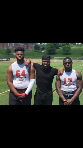 William Harrod (left) with a coach and fellow player. Photo @Omertawill_ Twitter