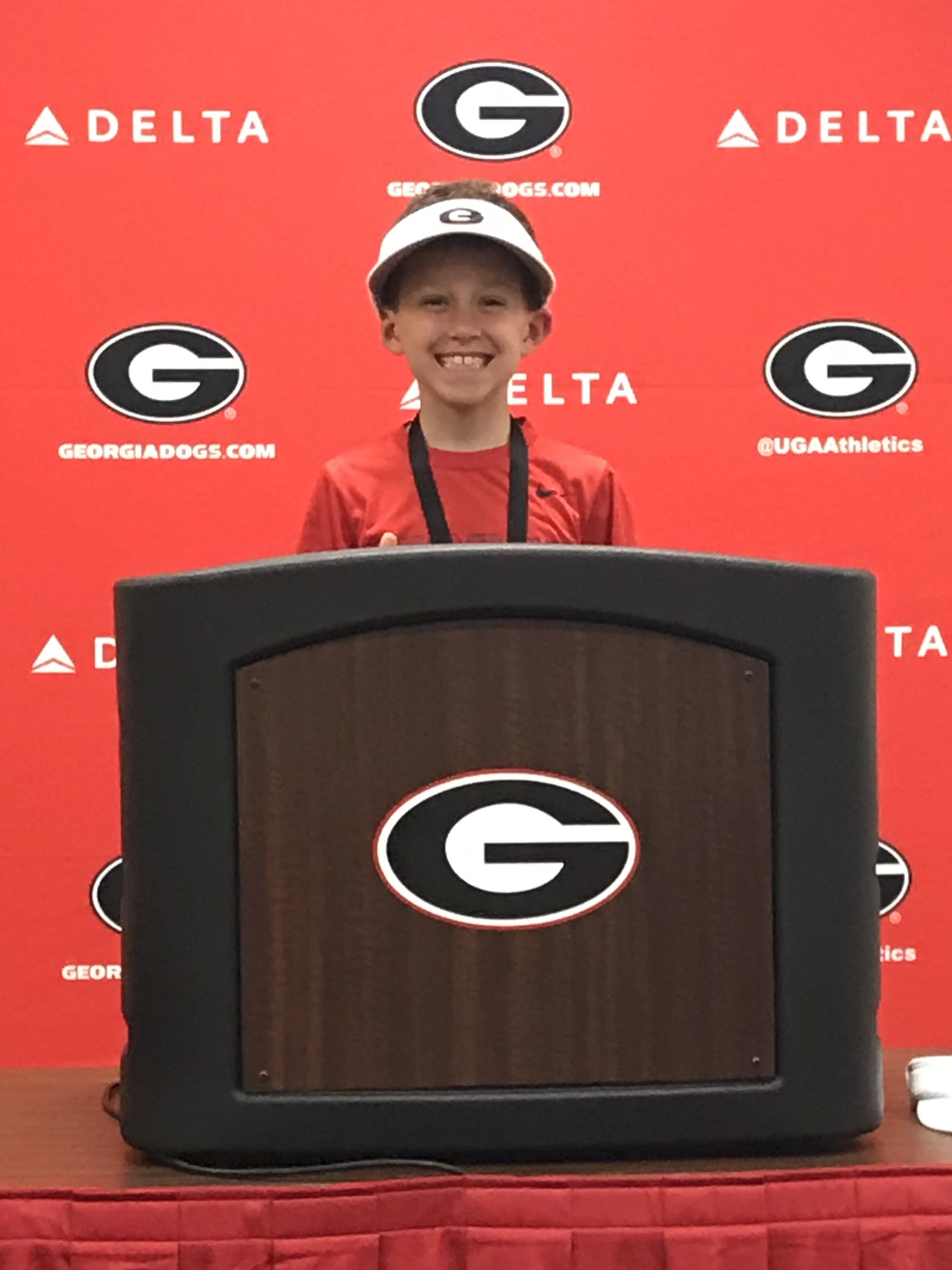 Jim Coleman (9) - Wide Receiver - At the podium, where Coach Smart gives his post game interviews, even wearing the visor to mimic Coach.