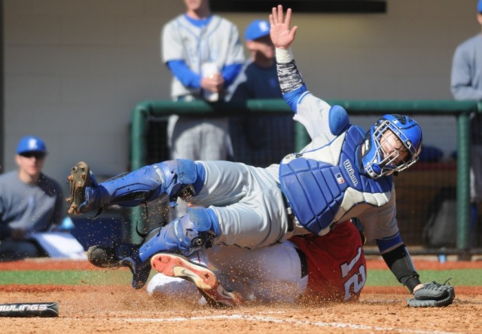 Georgia's Mike Bell (12) slides safe into home