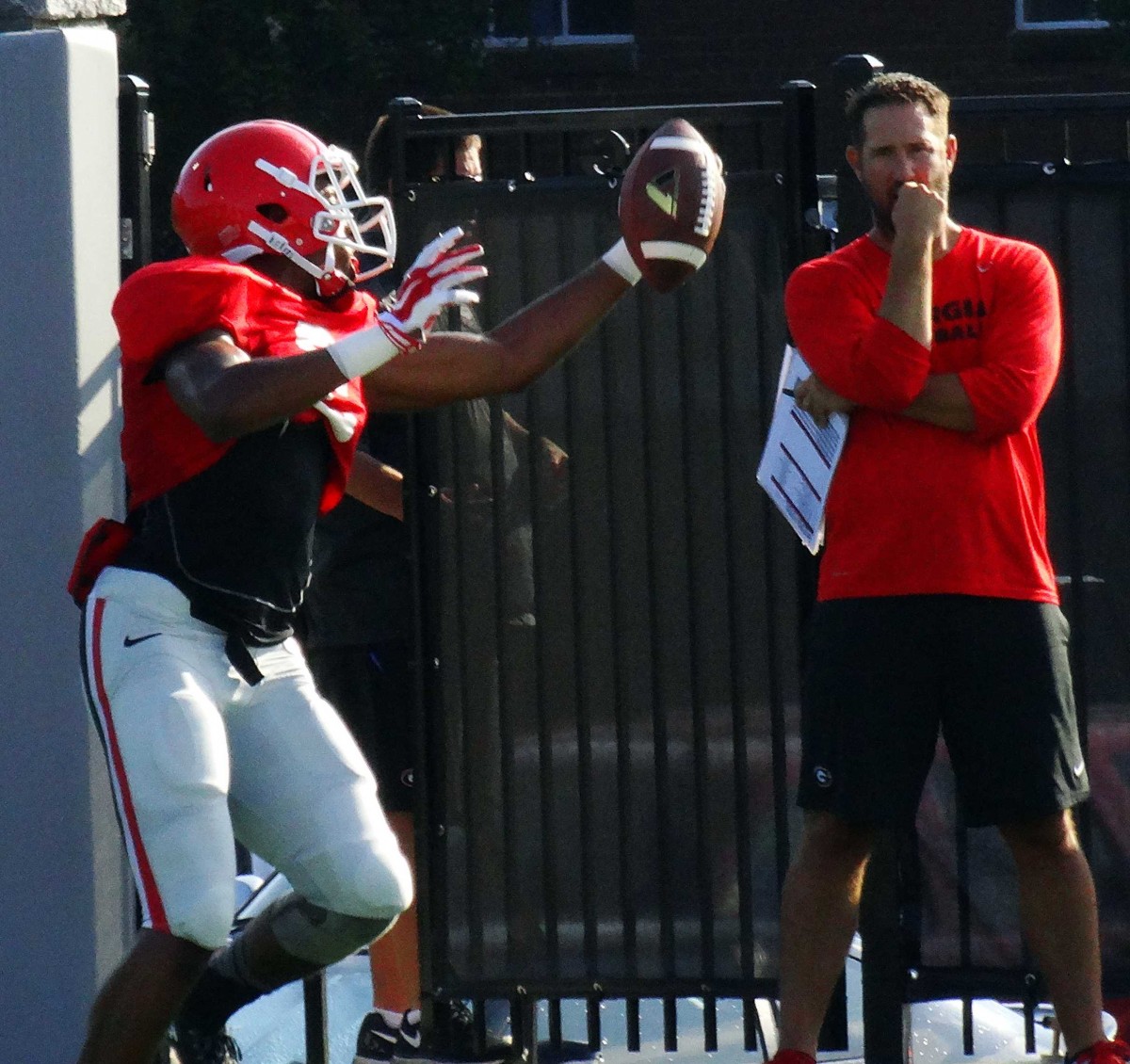 Offensive Coordinator Brian Schottenheimer looks on at Wide Receiver drills. Photo by Greg Poole/Bulldawg Illustrated.