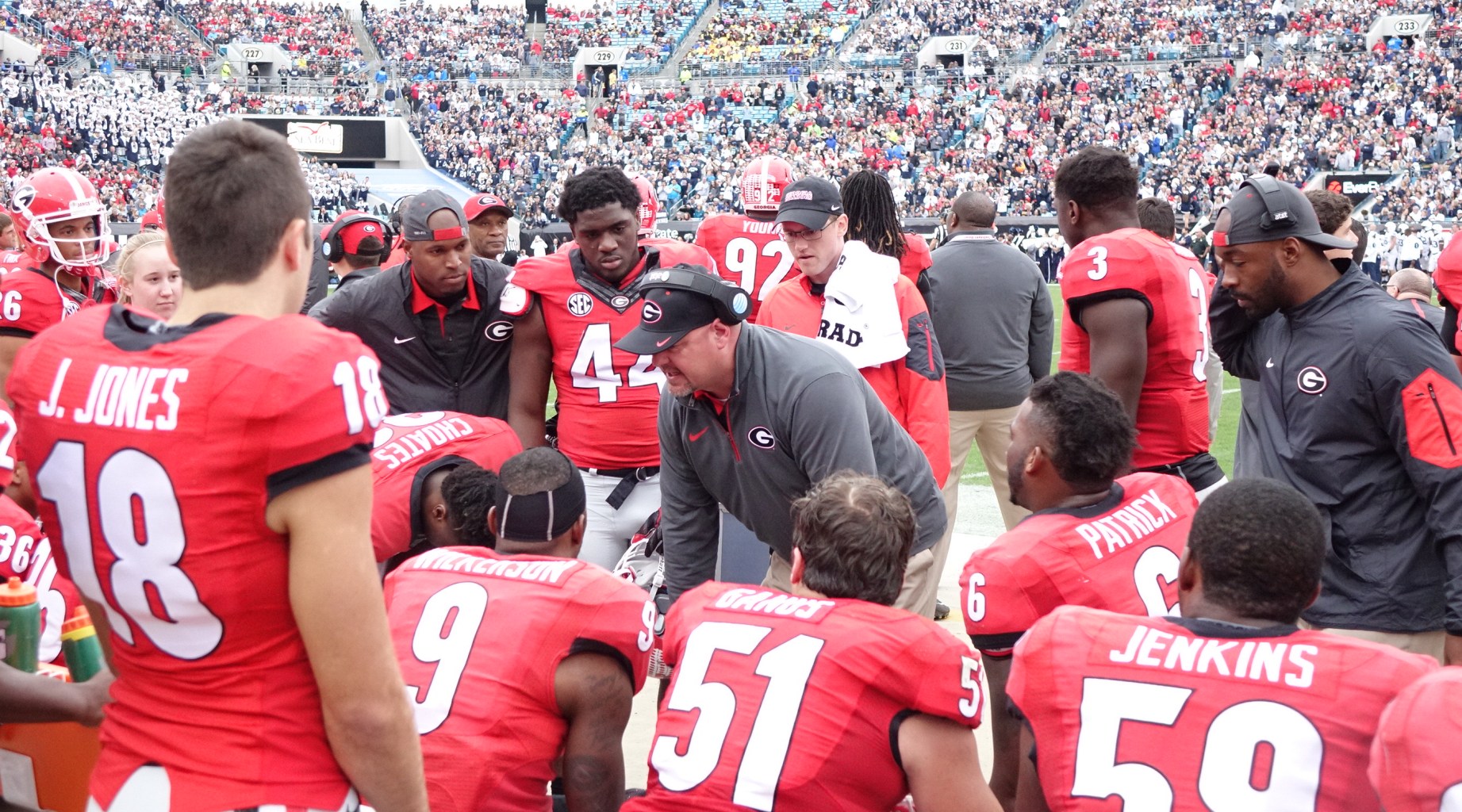 Georgia Defensive Coach Kevin Sherrer talks with defense after they get a stop - first half TaxSlayer Bowl 02-JAN-2016 (Photo by Greg Poole)