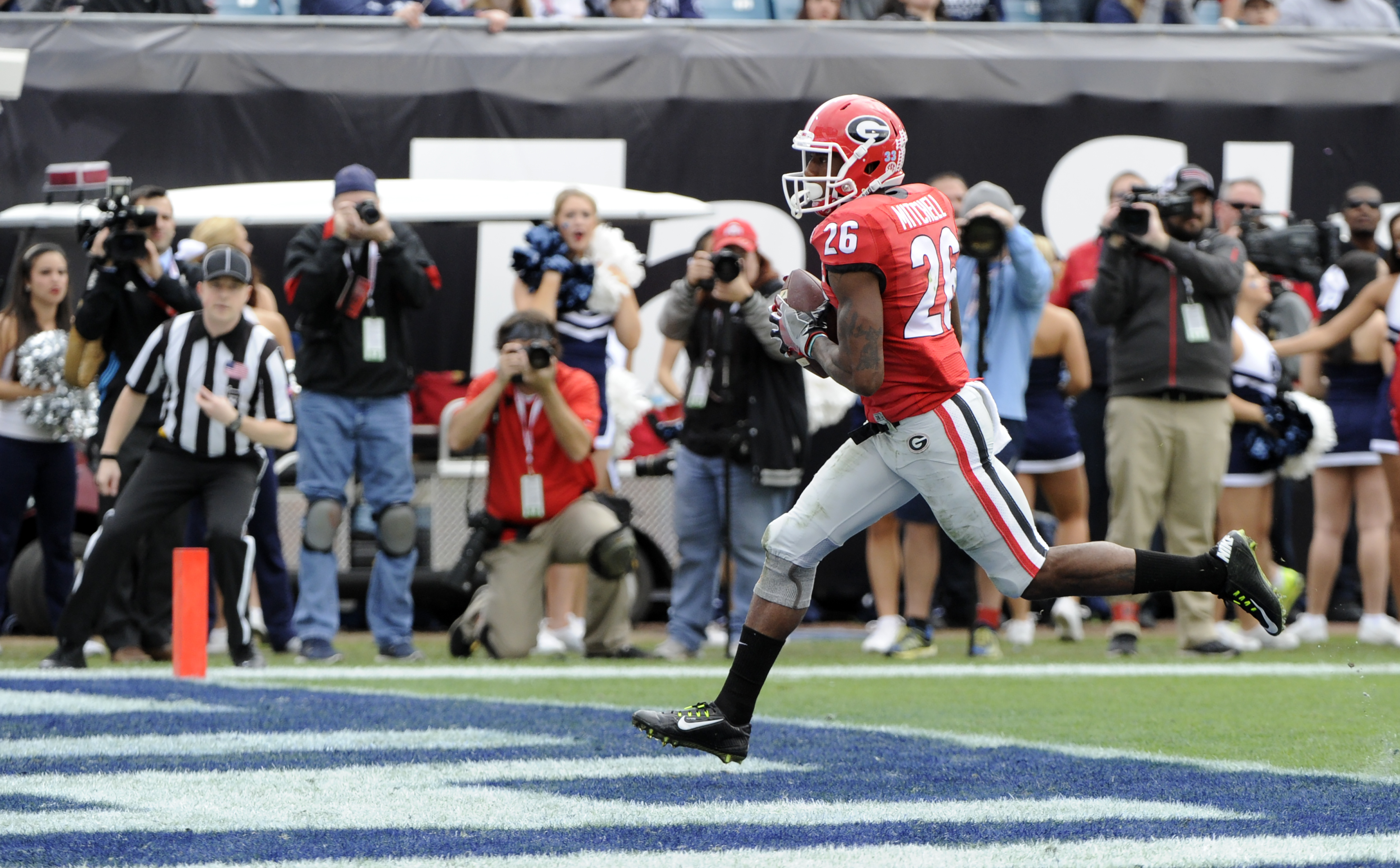 Georgia receiver Malcolm Mitchell (26) scores a touchdown during the Bulldogs' game against the Penn State Nittany Lions in the TaxSlayer Bowl on Saturday, Jan. 2, 2016 at EverBank Field in Jacksonville, Florida (Photo by John Kelley)