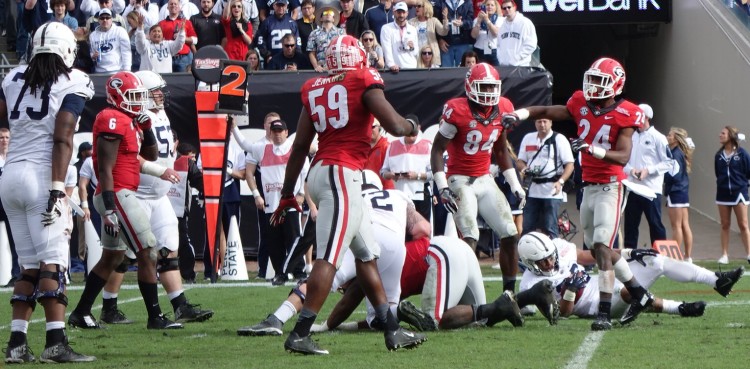 Georgia defense - No.6 Natrez Patrick, No.59 Jordan Jenkisn, No.84 Leonard Floyd, No. 24 Dominic Sanders - 2nd half TaxSlayer Bowl 02-JAN-2016 (photo by Greg Poole)