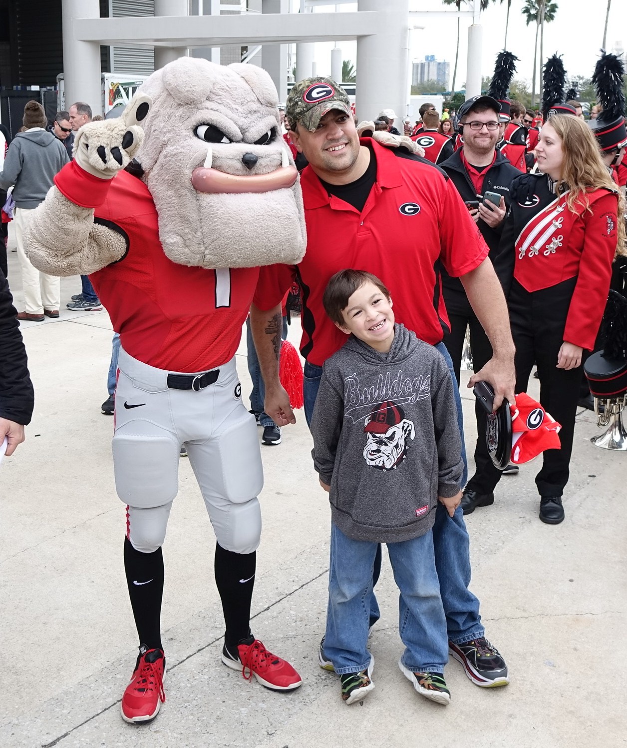 Hairy Dawg always eager to pose with fans for a photo op - Dawg Walk - TaxSlayer Bowl - 02-JAN-2016 (Photo by Greg Poole)