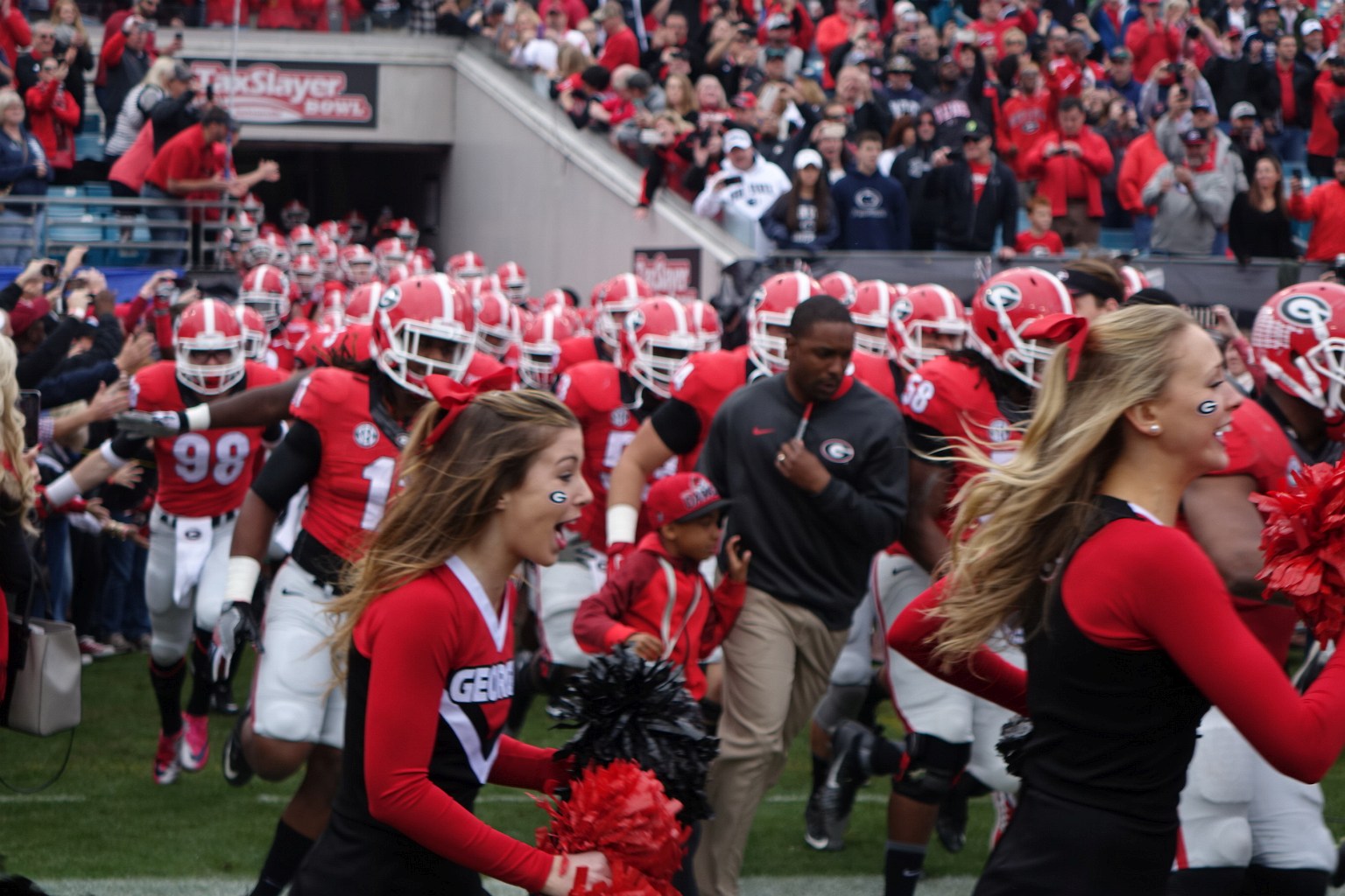 2015 Georgia Bulldogs run out of tunnel for the start of the TaxSlayer Bowl vs. Penn State on 02-JAN-2016 (Photo by Greg Poole)