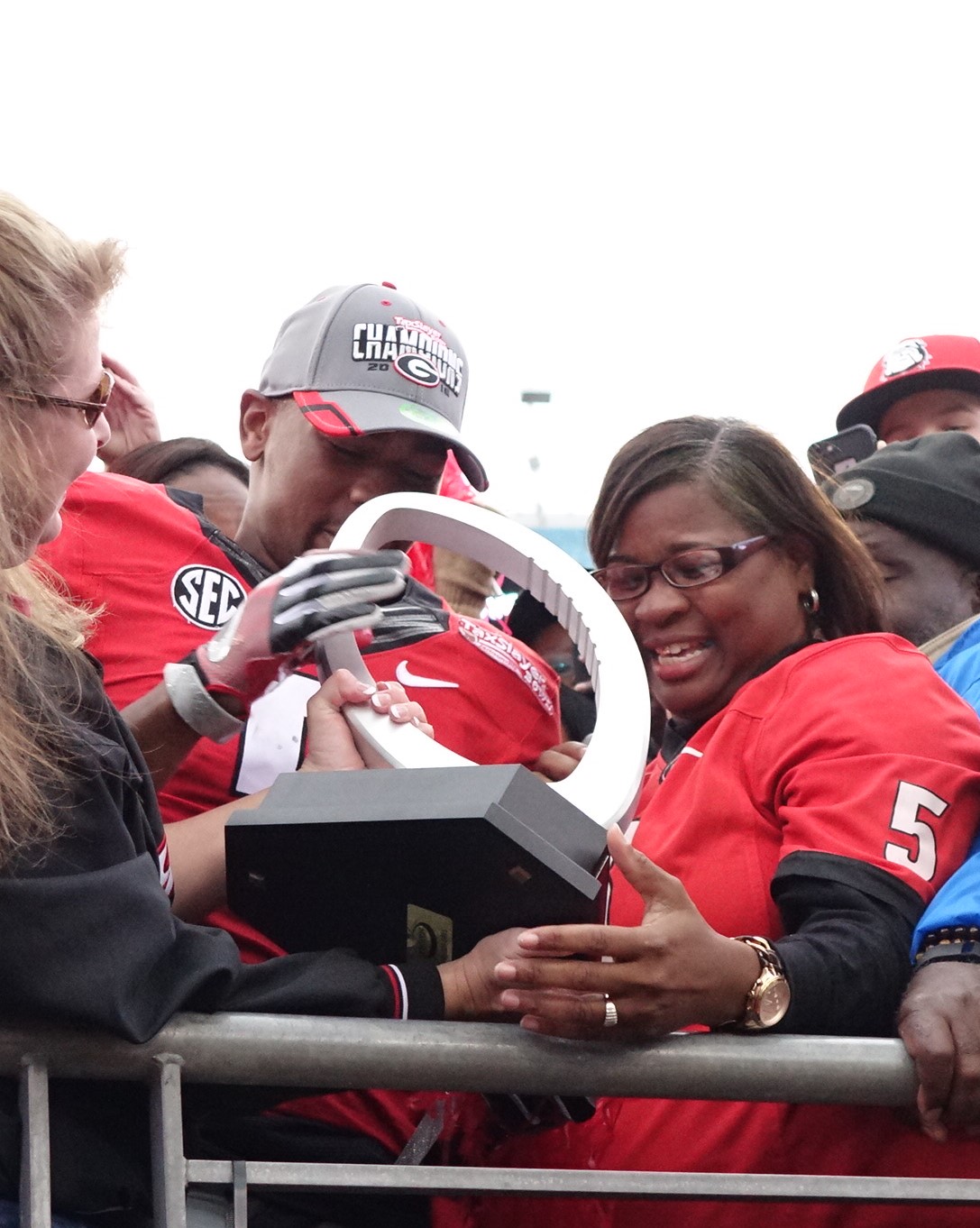 Terry Godwin shows his MVP trophy to his mom