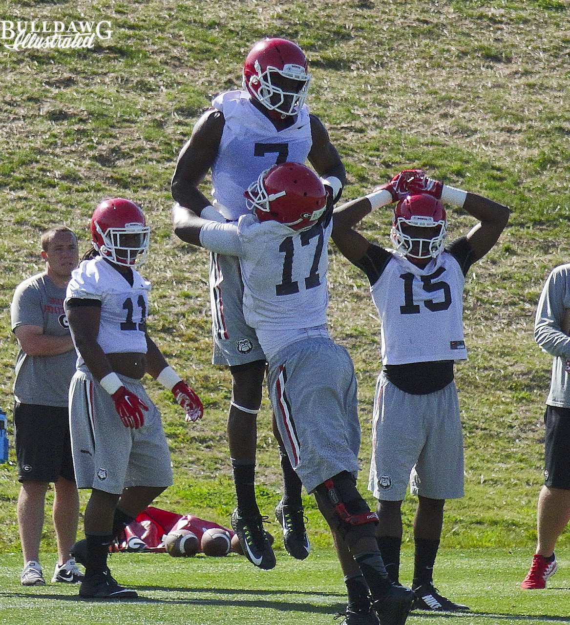 Davin Bellamy (17) tackles Lorenzo Carter (7) as Keyon Brown (11) and D'Andre Walker (15) look on