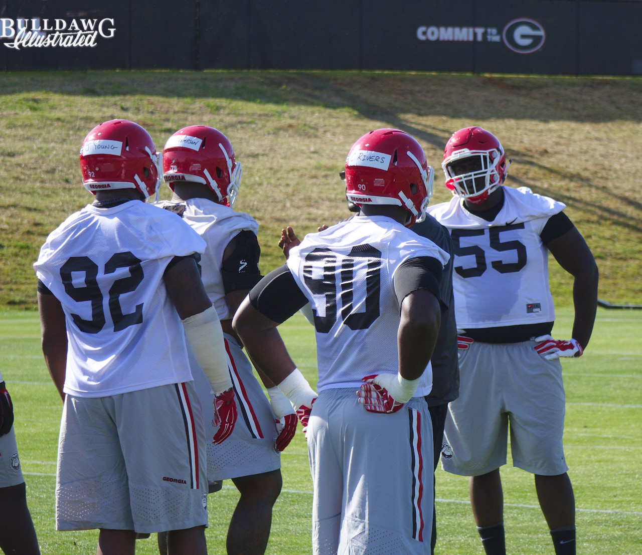 Dyshon Sims (55), Justin Young (92) and Chauncey Rivers (90) get a short break between reps