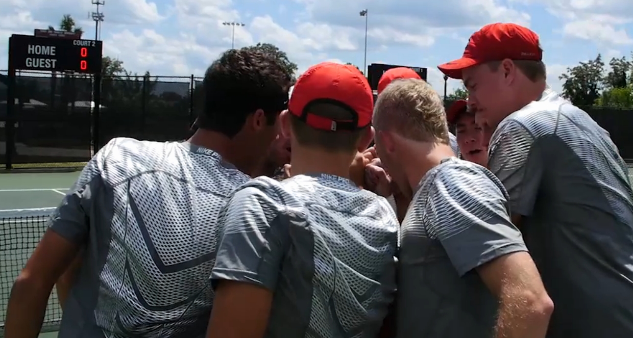GA men's tennis team huddles up for 2016 SEC tournament semi-final's match (photo is a screen capture of UGA video)