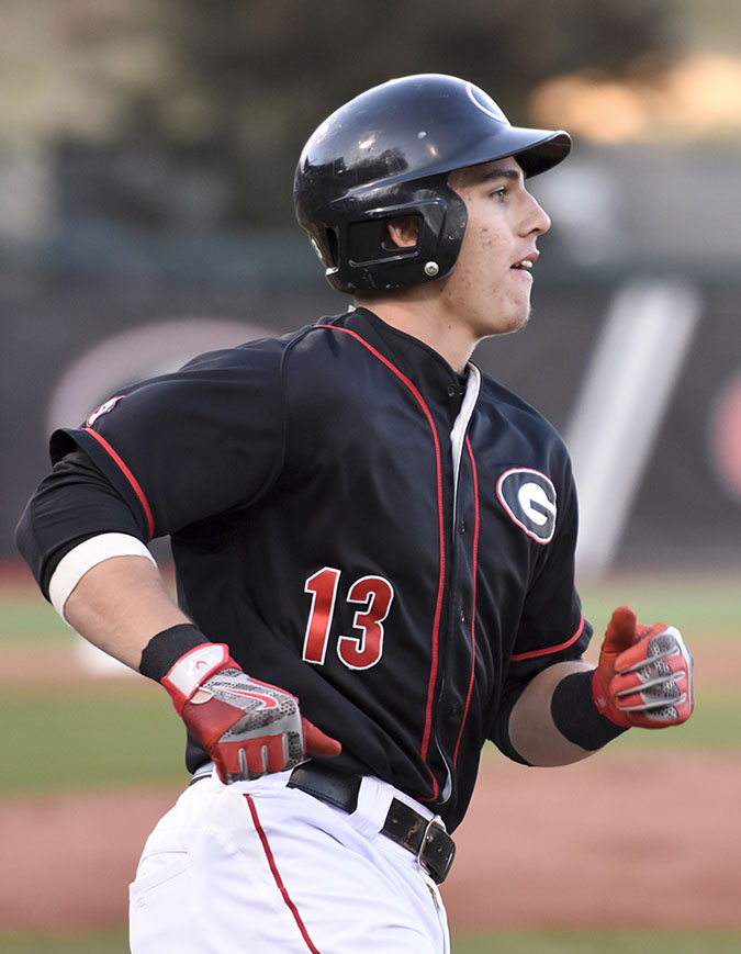 Georgia catcher Michael Curry (13) runs to first base during an NCAA baseball game between Georgia and Georgia Southern at Foley Field in Athens, Georgia on Friday, Feb. 19, 2016.