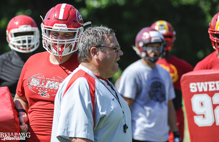 Offensive line coach Sam Pittman works with his group of campers
