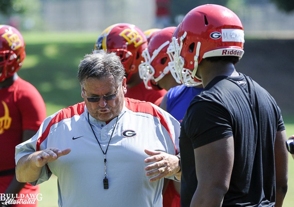 Coach Pittman gives Mike Edwards instruction