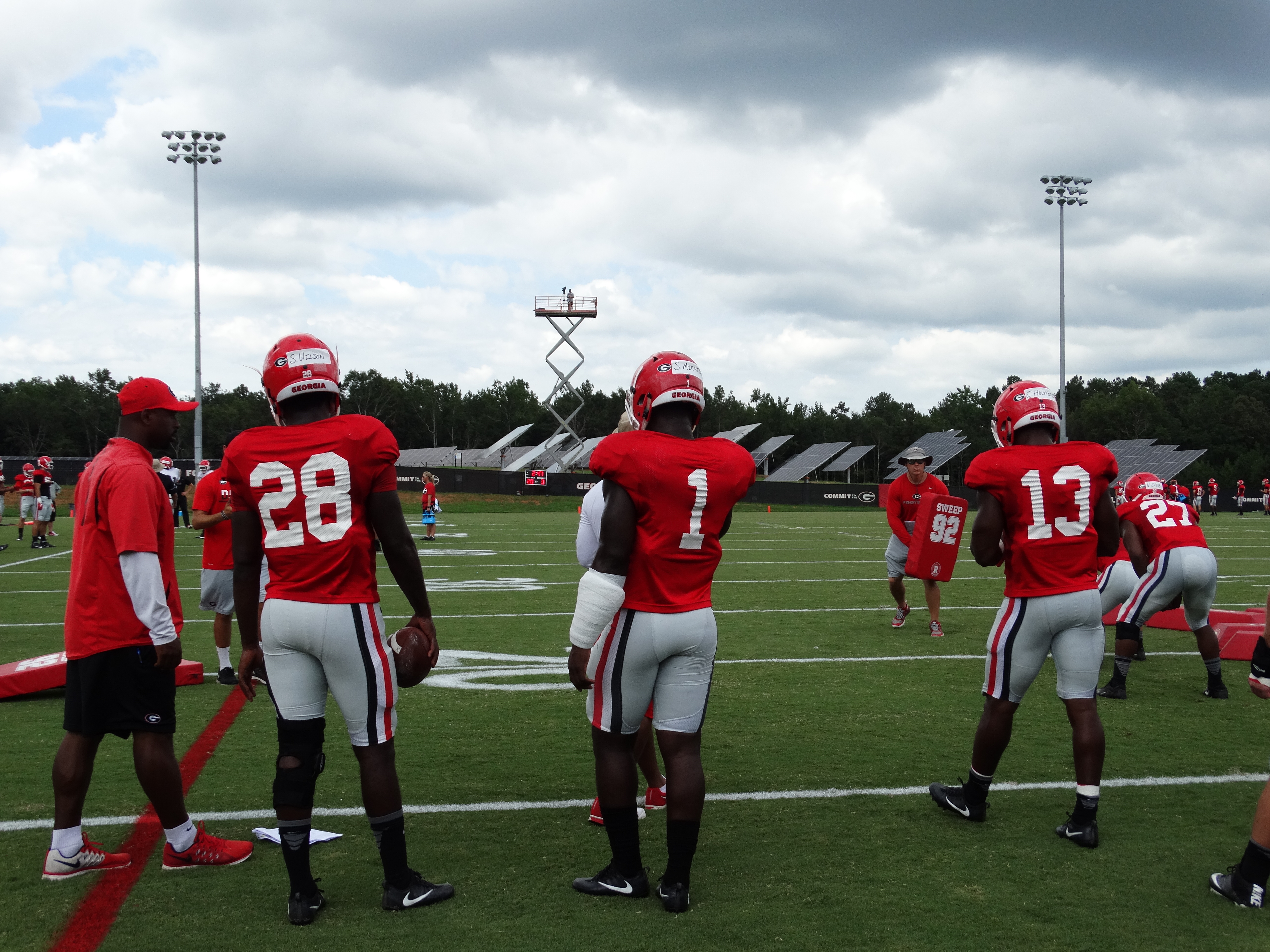 Shaquery Wilson, Sony Michel, Elijah Holyfield, and Nick Chubb during footwork drills