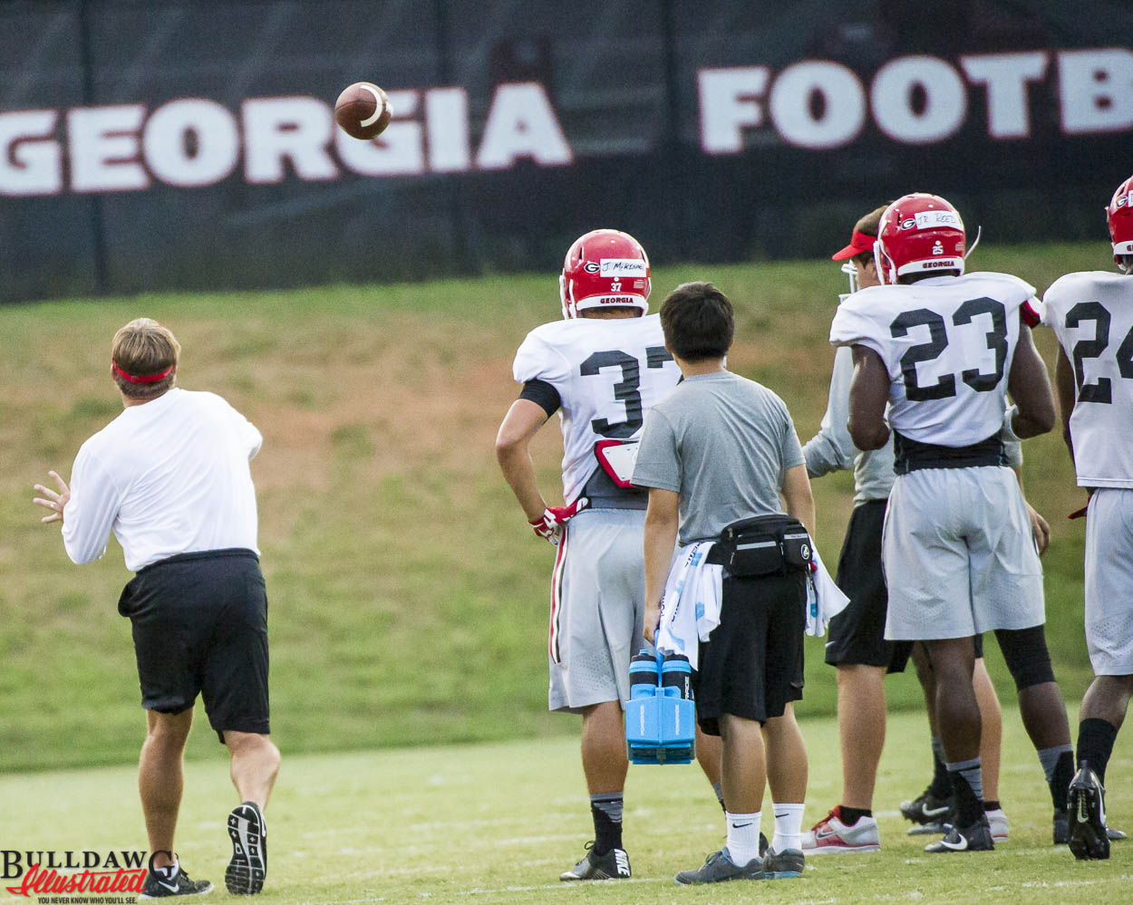 Kirby Smart works with the defensive backs