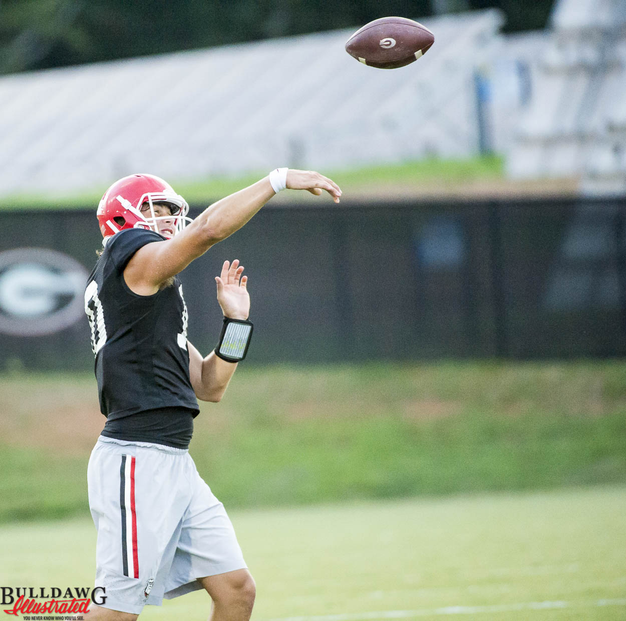 Jacob Eason throws with trainer during practice August 09, 2016