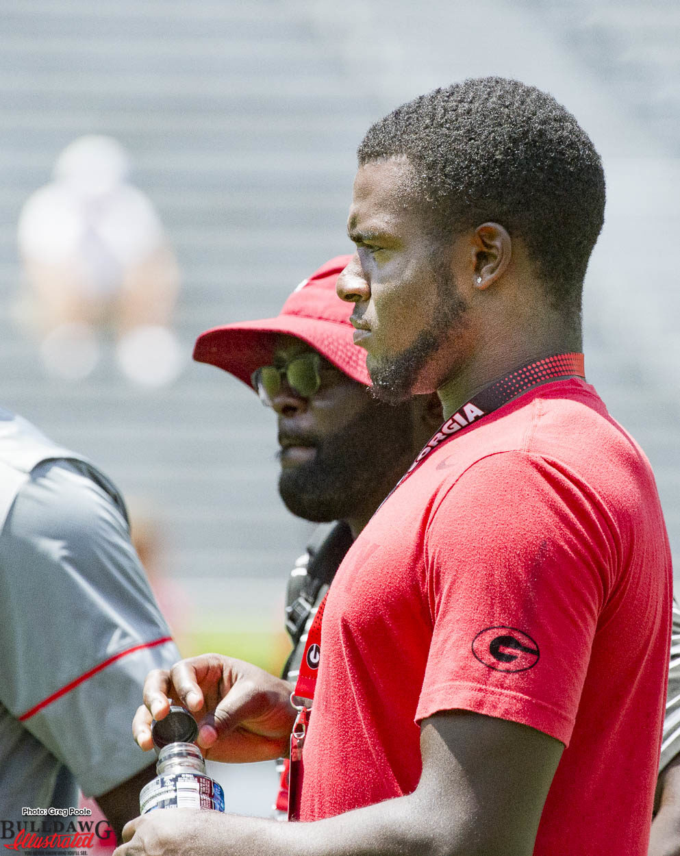 Recruiting prospect Leonard Warner watches warm-ups