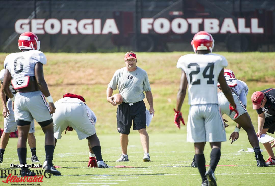 Kirby Smart looks on as the defense goes through drills. Natrez Patrick (6) and Dominick Sanders (24)