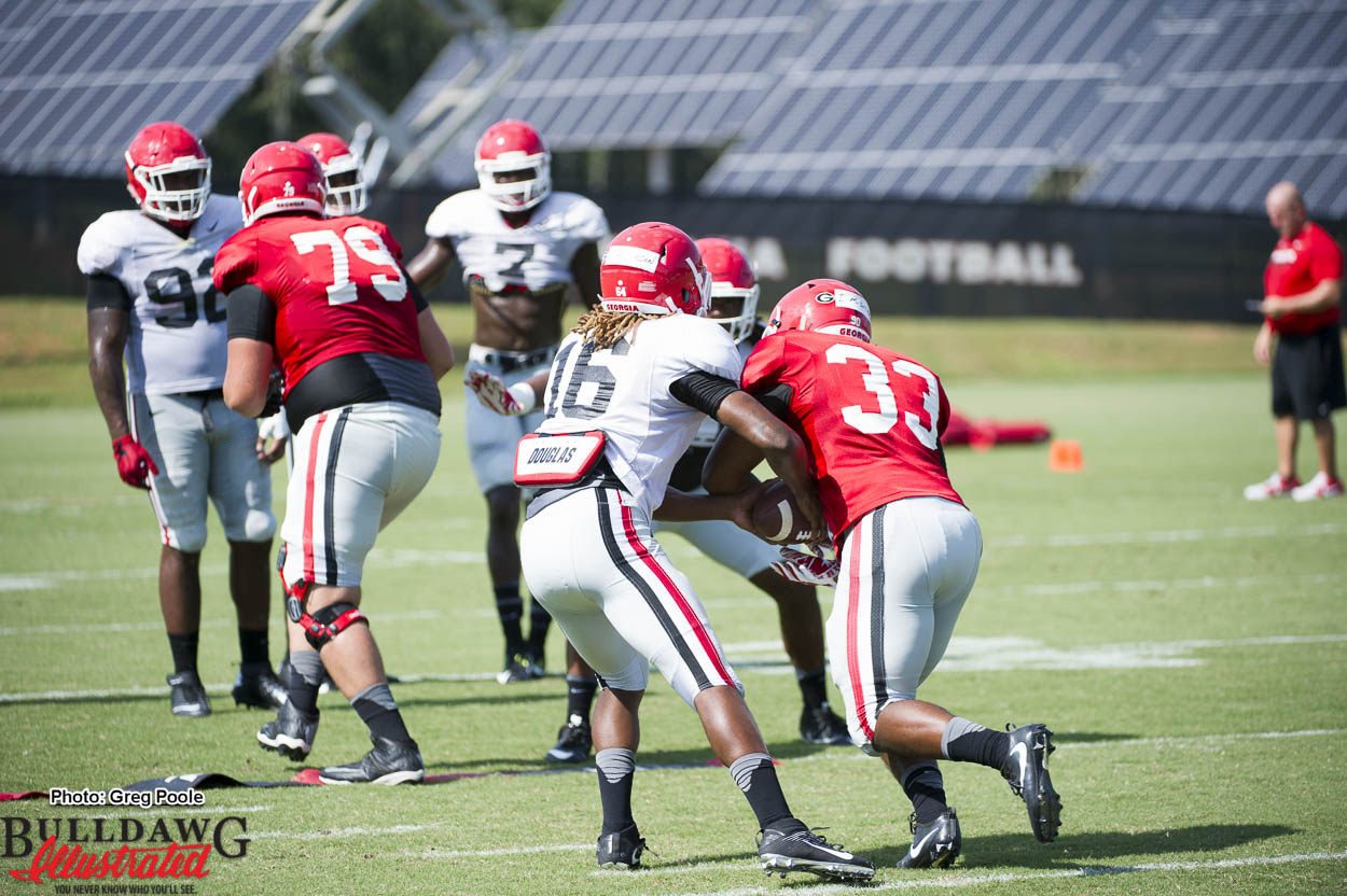 Caleeb Roberson (16) acting as QB to give UGA defense a spread option look in this drill