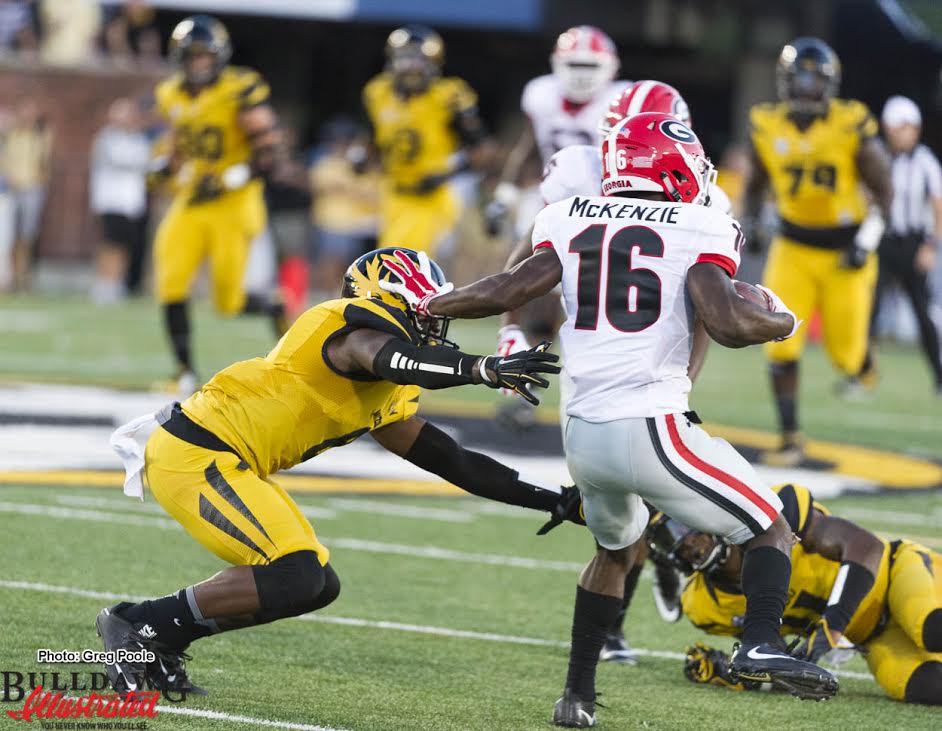 Isaiah McKenzie (16) with the stiff arm