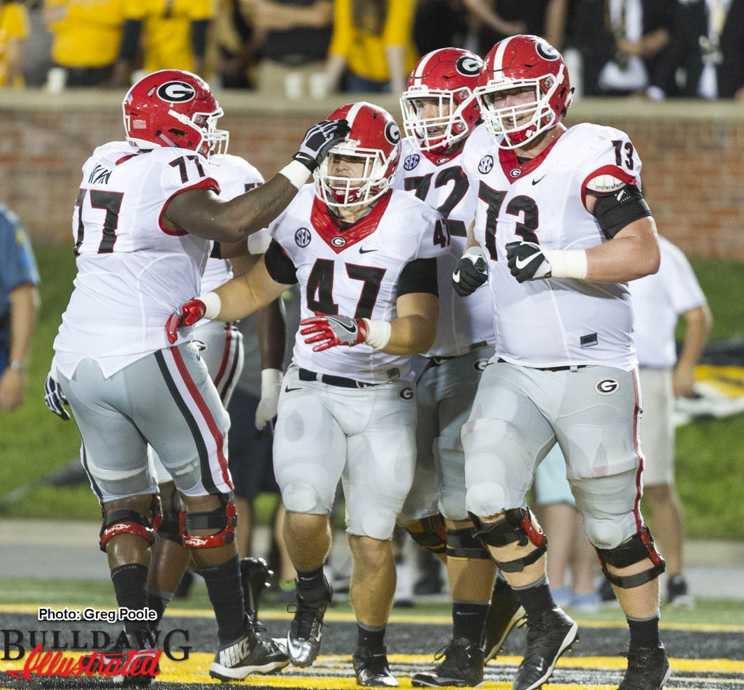 Georgia offensive line celebrates with FB Christian Payne (47) after his TD reception