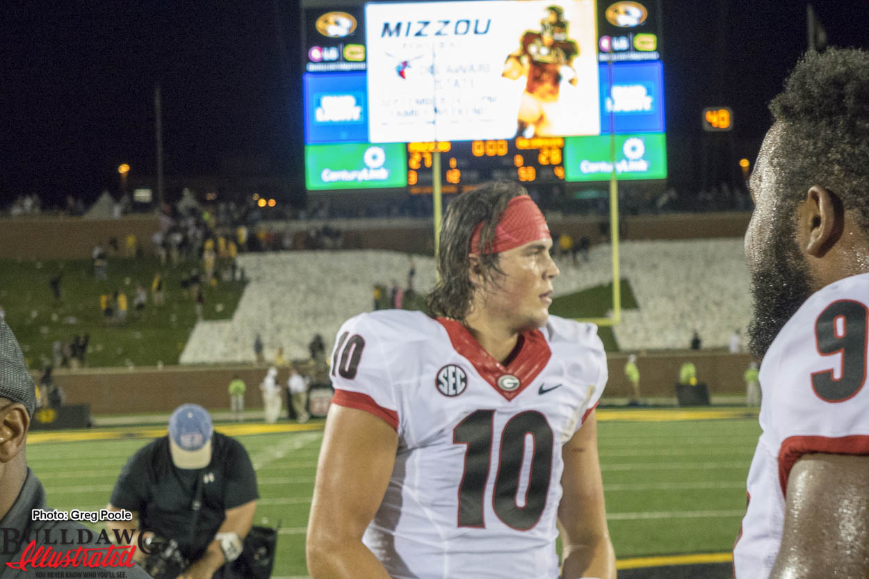 QB Jacob Eason celebrating with team after come from behind win